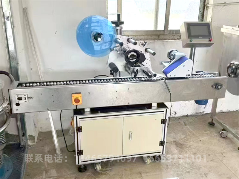 滾輪式平面貼標(biāo)機(jī).jpg 滾輪式平面貼標(biāo)機(jī).jpg