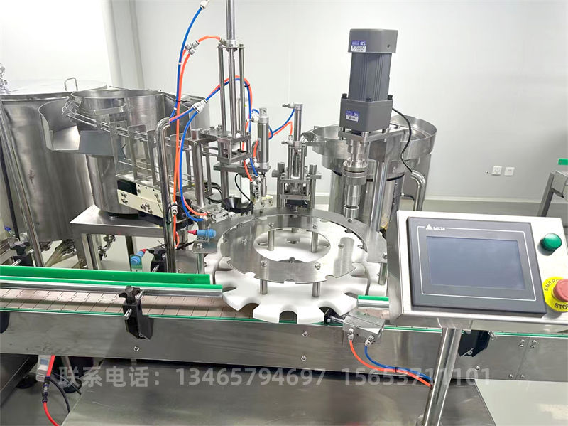 口服液灌裝旋蓋一體機(jī).jpg 口服液灌裝旋蓋一體機(jī).jpg